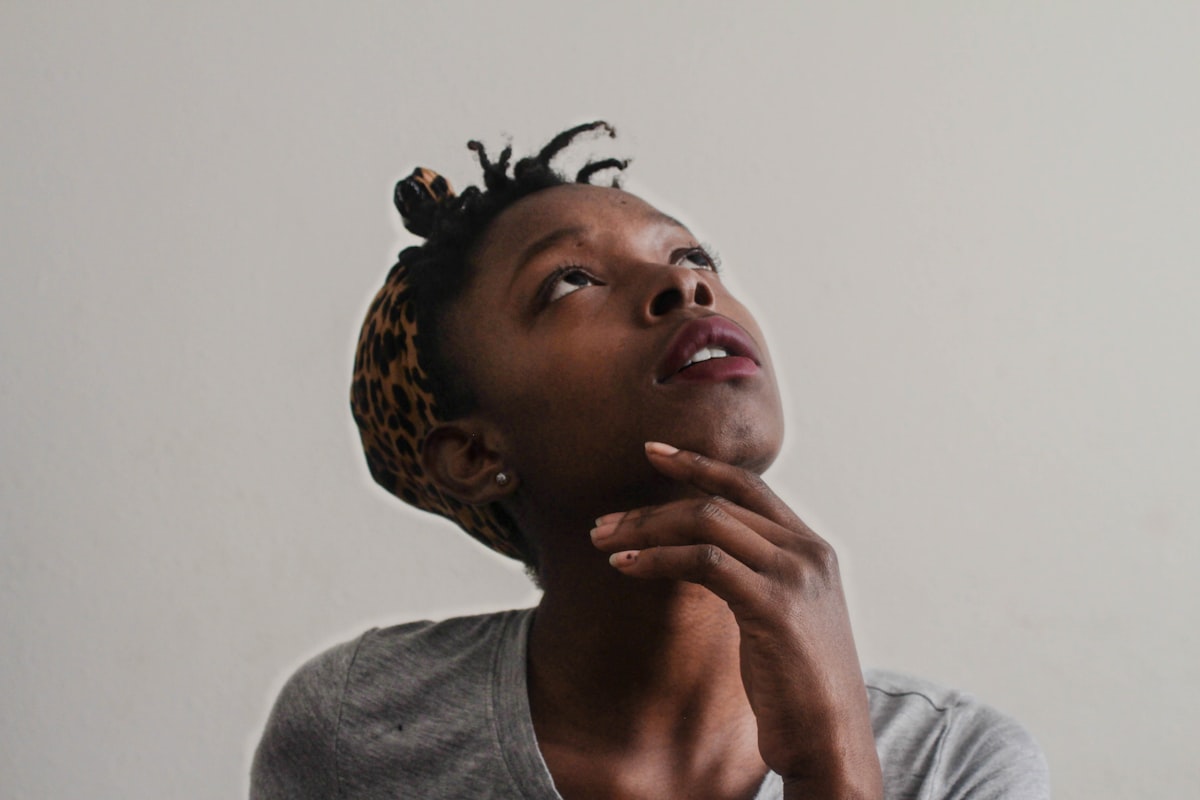 A young African woman pauses to reflect