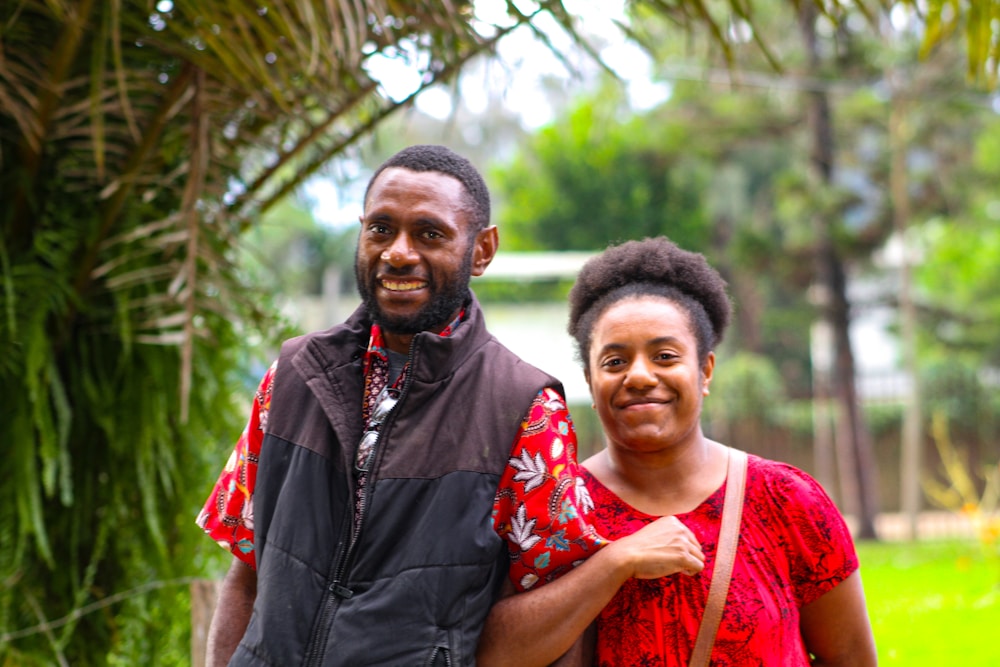 A young African couple smiling together outdoors